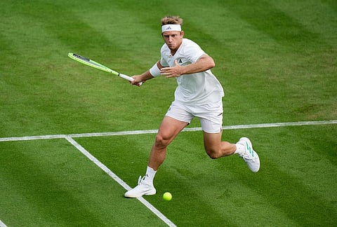 Alejandro Davidovich Fokina of Spain plays a forehand against Juan Manuel Cerundolo of Argentina in their first round men's singles match at the Wimbledon Tennis Championships in London, Monday, June 29, 2026. 