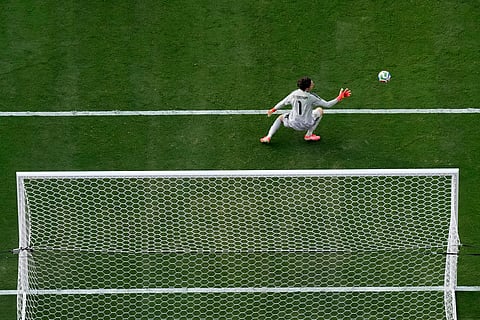 Sweden's Jacob Widell Zetterström cannot stop a goal by France's Bradley Barcola during a World Cup round of 32 soccer match