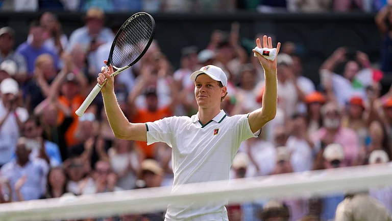 Jannik Sinner of Italy celebrates winning the men's singles match against Miomir Kecmanovic of Serbia during at the Wimbledon Tennis Championships in London, Monday, June 29, 2026. - (AP Photo/Kin Cheung)