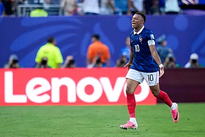AP/Frank Franklin II : Frances Kylian Mbappe (10) celebrates scoring their first goal during the World Cup round of 32 soccer match