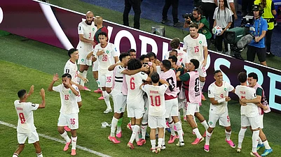 (AP Photo/Moises Castillo) : Moroccos Issa Diop (14) celebrates with teammates after scoring their first goal during the World Cup round of 32 soccer match between the Netherlands and Morocco in Guadalupe, near Monterrey, Mexico, Monday, June 29, 2026.