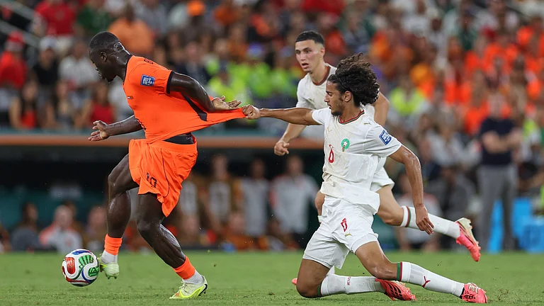 Morocco's Ayyoub Bouaddi (6) grabs the jersey of Netherlands' Brian Brobbey (19) during the World Cup round of 32 soccer match between the Netherlands and Morocco in Guadalupe, near Monterrey, Mexico, Monday, June 29, 2026. - (AP Photo/Addison Simmons)