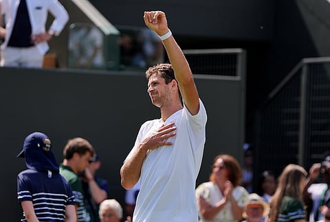 Hubert Hurkacz of Poland celebrates after winning against Casper Ruud of Norway in their first round men's singles match at the Wimbledon Tennis Championships in London, Monday, June 29, 2026.