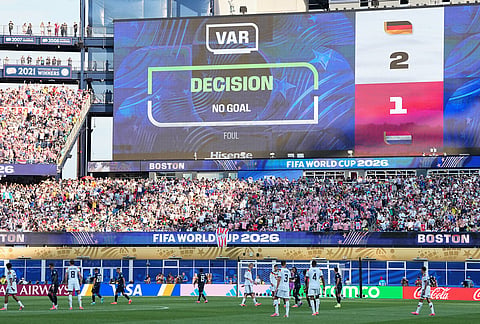 The screen shows that a goal by Germany's Jonathan Tah (4) was disqualified after a VAR check during the World Cup round of 32 soccer match between Germany and Paraguay in Foxborough, Mass., near Boston.