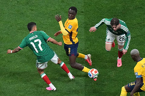 Ecuador's Yaimar Medina (26) challenges for the ball with Mexico's Orbelin Pineda (17) and Brian Gutierrez (26) during the World Cup round of 32 soccer match between Mexico and Ecuador in Mexico City, Tuesday, June 30, 2026.
