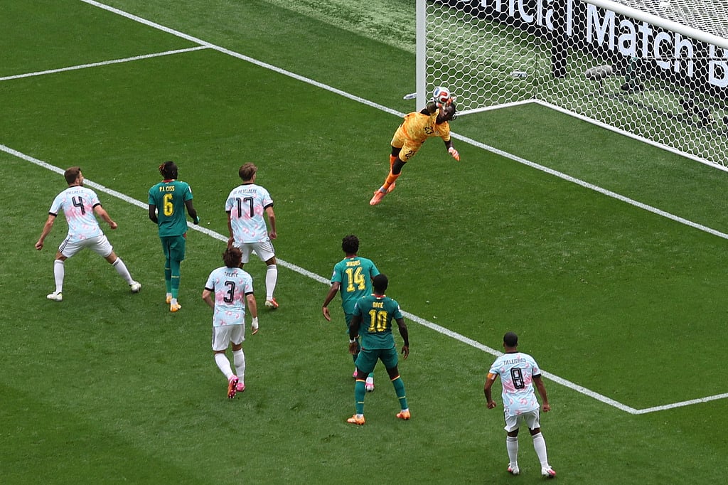 Senegal goalkeeper Mory Diaw makes a save during the World Cup round of 32 soccer match against Belgium in Seattl