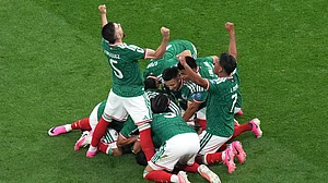 AP Photo/Silvia Izquierdo : Mexico's Raul Jimenez (9) celebrates with teammates after scoring their second goal during the World Cup round of 32 soccer match between Mexico and Ecuador in Mexico City, Tuesday, June 30, 2026.