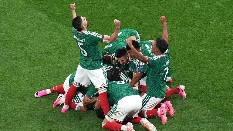Mexico's Raul Jimenez (9) celebrates with teammates after scoring their second goal during the World Cup round of 32 soccer match between Mexico and Ecuador in Mexico City, Tuesday, June 30, 2026. - AP Photo/Silvia Izquierdo