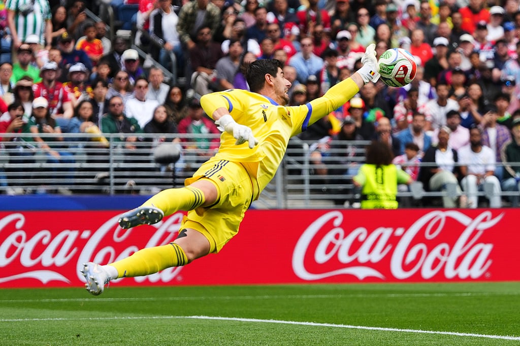 Belgium goalkeeper Thibaut Courtois (1) dives for the ball during the World Cup round of 32 soccer match between Belgium and Senegal 