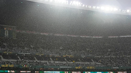 AP Photo/Fernando Llano : Rain falls as fans wait for the start of the World Cup round of 32 soccer match between Mexico and Ecuador in Mexico City, Tuesday, June 30, 2026.