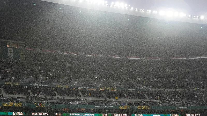 AP Photo/Fernando Llano : Rain falls as fans wait for the start of the World Cup round of 32 soccer match between Mexico and Ecuador in Mexico City, Tuesday, June 30, 2026.