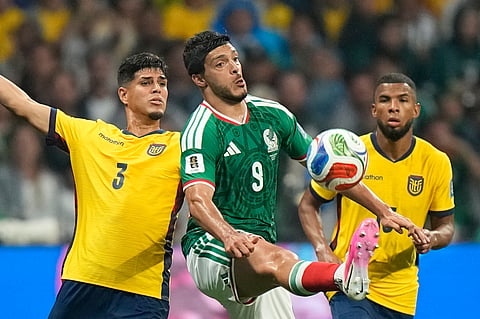 Mexico's Raul Jimenez (9) battles for the ball with Ecuador's Piero Hincapie (3) during the World Cup round of 32 soccer match between Mexico and Ecuador in Mexico City, Tuesday, June 30, 2026.