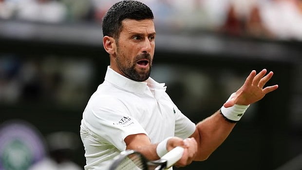 Novak Djokovic in action today on the Centre Court - GETTY IMAGES