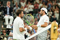 | Photo: AP/Kirsty Wigglesworth : Matteo Berrettini of Italy, right, and Stan Wawrinka of Switzerland shake hands after their first round men's singles match at the Wimbledon Tennis Championships in London, Tuesday, June 30, 2026. 
