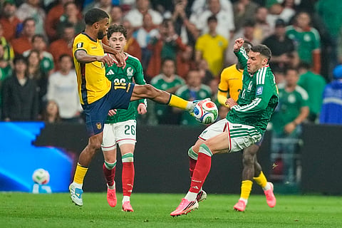 Ecuador's Pedro Vite (15) and Mexico's Santiago Gimenez (11) battle for the ball during the World Cup round of 32 soccer match between Mexico and Ecuador in Mexico City, Tuesday, June 30, 2026.