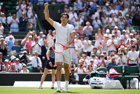 Taylor Fritz of the United States celebrates winning against Dusan Lajovic of Serbia in their first round men's singles match at the Wimbledon Tennis Championships in London, Tuesday, June 30, 2026. 