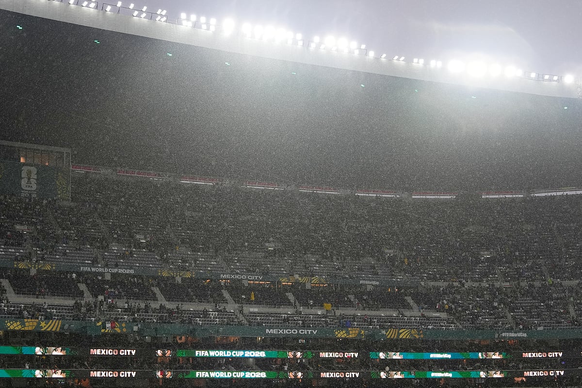 Rain falls as fans wait for the start of the World Cup round of 32 soccer match between Mexico and Ecuador in Mexico City, Tuesday, June 30, 2026.