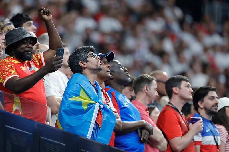 Gongos fans listen the national anthem ahead the World Cup round of 32 soccer match between England and Congo in Atlanta