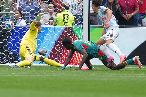 Senegal's Ismaila Sarr, center, scores their second goal past Belgium goalkeeper Thibaut Courtois, left, and Arthur Theate (3) during the World Cup round of 32 soccer match between Belgium and Senegal in Seattle