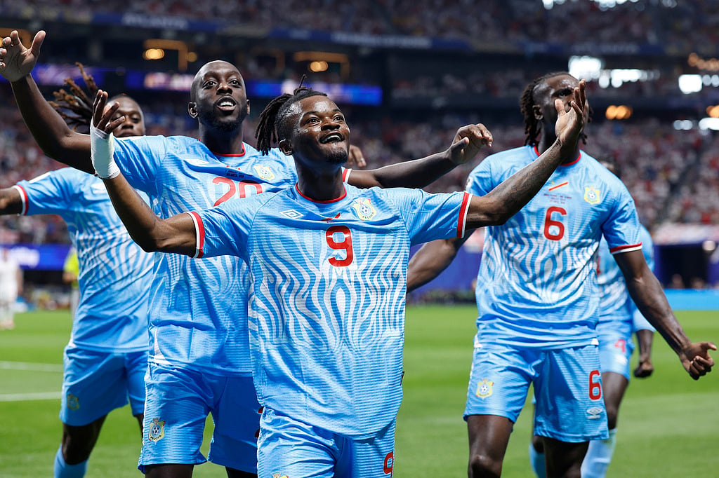 Congos Brian Cipenga (9) celebrates with teammates after scoring their first goal during the World Cup round of 32 soccer match between England and Congo in Atlanta.