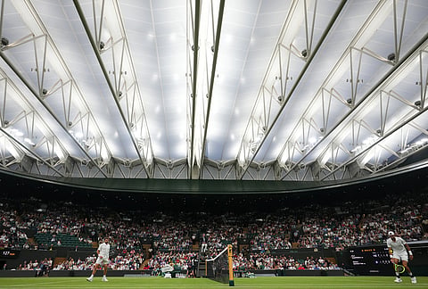 General view during the first round men's singles match between Stan Wawrinka of Switzerland, left, and Matteo Berrettini of Italy, right, at the Wimbledon Tennis Championships in London, Tuesday, June 30, 2026. 