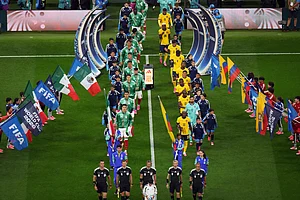 (AP Photo/Silvia Izquierdo) : Players and referees enter the field before the World Cup round of 32 soccer match between Mexico and Ecuador in Mexico City, Tuesday, June 30, 2026.