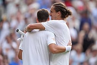 | Photo: AP/Maja Smiejkowska : Winner Alexander Zverev of Germany, right, hugs Alexander Blockx of Belgium after their first round men's singles match, at the Wimbledon Tennis Championships in London, Tuesday, June 30, 2026. 