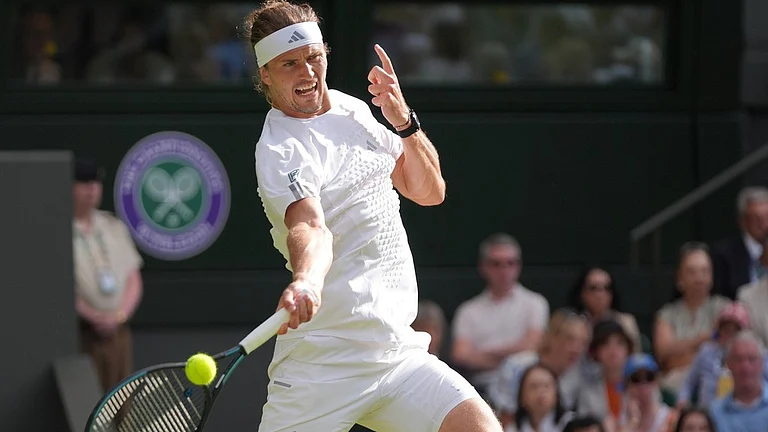 Alexander Zverev of Germany plays a forehand against Alexander Blockx of Belgium in their first round men's singles match at the Wimbledon Tennis Championships in London, Tuesday, June 30, 2026. - AP Photo/Maja Smiejkowska