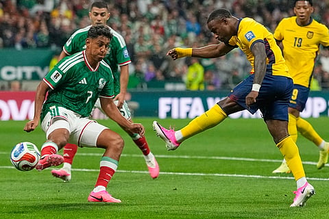 Ecuador's John Yeboah (9) takes a shot at goal as Mexico's Luis Romo (7) attempts to block during the World Cup round of 32 soccer match between Mexico and Ecuador in Mexico City, Tuesday, June 30, 2026.