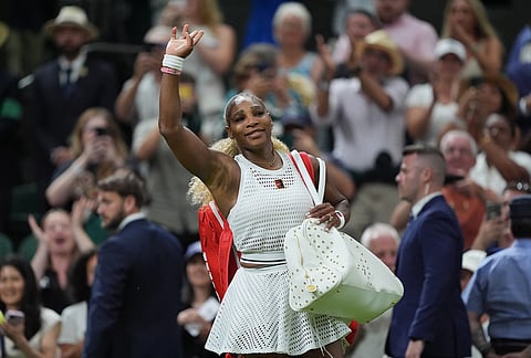 Serena Williams of the United States greets the audience as she leaves after losing to Maya Joint of Australia in their first round women's singles match at the Wimbledon Tennis Championships in London, Tuesday, June 30, 2026. 