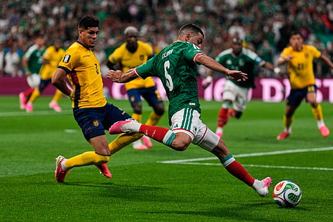 Mexico's Johan Vasquez, right, kicks the ball past Ecuador's Piero Hincapie during the World Cup round of 32 soccer match in Mexico City, Tuesday, June 30, 2026.