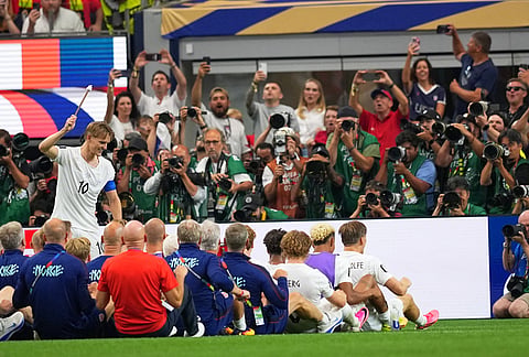 Norway's Martin Oedegaard (10) leads the viking row, after the end of the World Cup round of 32 soccer match between Ivory Coast and Norway in Arlington, Texas, near Dallas, Tuesday, June 30, 2026. 