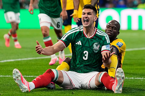 Mexico's Cesar Montes, left, argues a call made by the referee during the World Cup round of 32 soccer match against Ecuador in Mexico City, Tuesday, June 30, 2026.