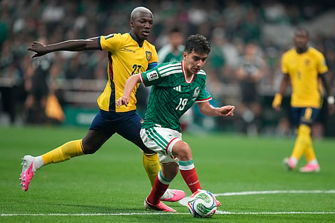 Mexico's Gilberto Mora (19) battles for the ball with Ecuador's Moises Caicedo (23) during the World Cup round of 32 soccer match between Mexico and Ecuador in Mexico City, Tuesday, June 30, 2026.