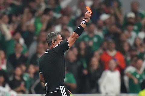 Referee Slavko Vincic, of Slovenia shows a red card to Ecuador's Piero Hincapie (3),not in picture, during the World Cup round of 32 soccer match between Mexico and Ecuador in Mexico City, Tuesday, June 30, 2026.