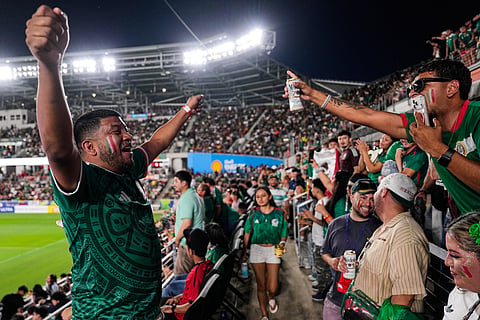 Mexico fans cheer at Shell Energy Stadium, home of the MLS soccer club Houston Dynamo, as they watch a live broadcast in Houston, of a World Cup soccer round of 32 match between Mexico and Ecuador, Tuesday, June 30, 2026.