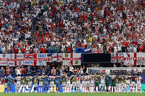 England players stand in front of their fans after the end of the World Cup round of 32 soccer match between England and Congo in Atlanta