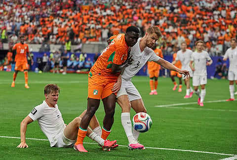 Norway's Kristoffer Ajer (3) challenges for the ball with with Ivory Coast's Oumar Diakite (14) during the FIFA World Cup Round of 32 soccer match between Ivory Coast and Norway in Arlington, Texas, near Dallas, Tuesday, June 30, 2026.
