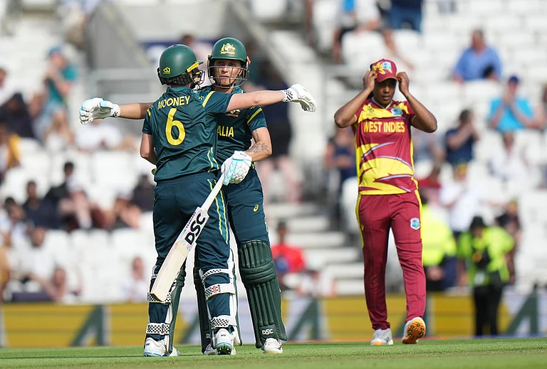 Australia's Beth Mooney, left, and Australia's Ashleigh Gardner celebrates after winning the Women's T20 Cricket World Cup semifinal against West Indies in London, Tuesday, June 30, 2026. - | Photo: AP/Alastair Grant