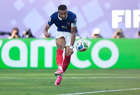 France's Kylian Mbappe (10) scores his team's third goal during the World Cup round of 32 soccer match between France and Sweden in East Rutherford, N.J., near New York.