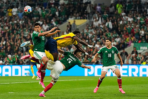 Mexico's Jesus Gallardo, left, jumps for the ball with Ecuador's Jordy Caicedo during the World Cup round of 32 soccer match in Mexico City, Tuesday, June 30, 2026.