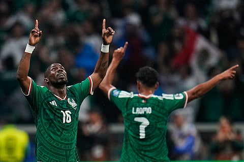 Mexico's Julian Quinones, left, celebrates with Luis Romo after scoring his side's opening goal during the World Cup round of 32 soccer match against Ecuador in Mexico City, Tuesday, June 30, 2026.