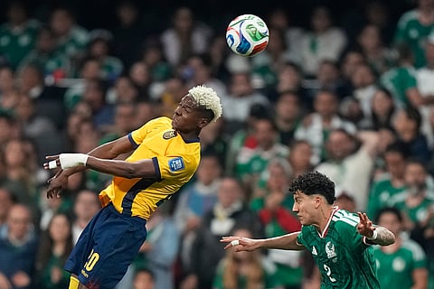 Ecuador's Nilson Angulo (20) battles for the ball with Mexico's Jorge Sanchez (2) during the World Cup round of 32 soccer match between Mexico and Ecuador in Mexico City, Tuesday, June 30, 2026. 