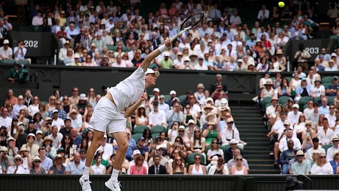 Jannik Sinner send in a serve to Nuno Borges - Reuters