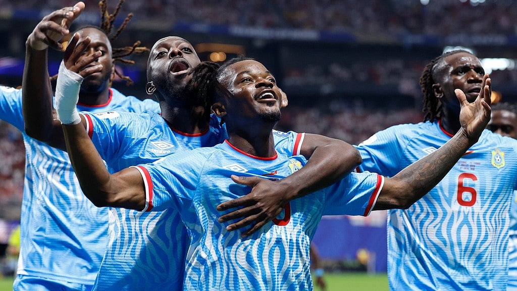 Congo's Brian Cipenga (9) celebrates with teammates after scoring their first goal during the World Cup round of 32 soccer match between England and Congo in Atlanta. - AP Photo/Butch Dill
