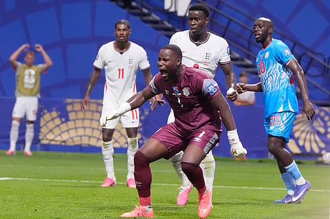 Congo goalkeeper Lionel Mpasi shouts during a World Cup round of 32 soccer match against England in Atlanta