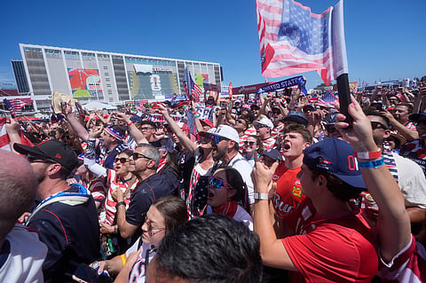 United States fans cheer outside the stadium before the World Cup round of 32 soccer match between the United States and Bosnia in Santa Clara, Calif