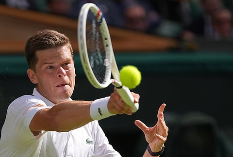 Alexander Blockx of Belgium plays a forehand against Alexander Zverev of Germany in their first round men's singles match at the Wimbledon Tennis Championships in London, Tuesday, June 30, 2026.