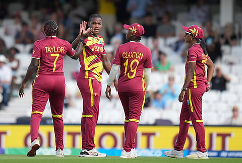 West Indies' Chinelle Henry, second from left, celebrates with teammates the wicket of Australia's Georgia Voll during the Women's T20 Cricket World Cup semifinal between Australia and West Indies in London, Tuesday, June 30, 2026. 