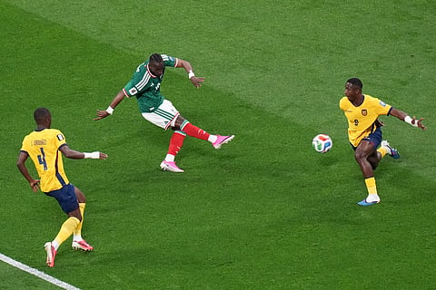 Mexico's Julian Quinones (16) scores their first goal against Ecuador's Willian Pacho (6) during the World Cup round of 32 soccer match between Mexico and Ecuador in Mexico City, Tuesday, June 30, 2026.